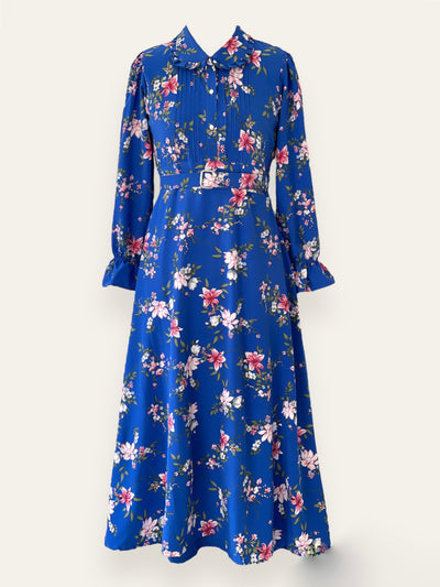 Long-sleeve floral print dress with a belted waist and pleated bodice